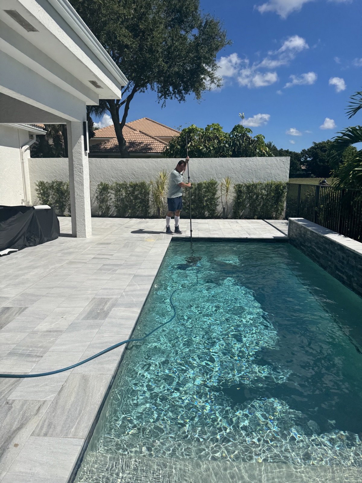 Florida's Best Pools technician servicing a pool in South Florida